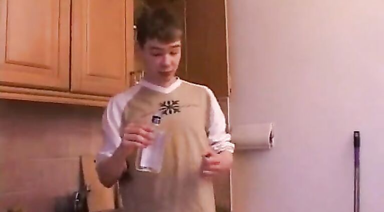 Mature mom and young guy on the kitchen